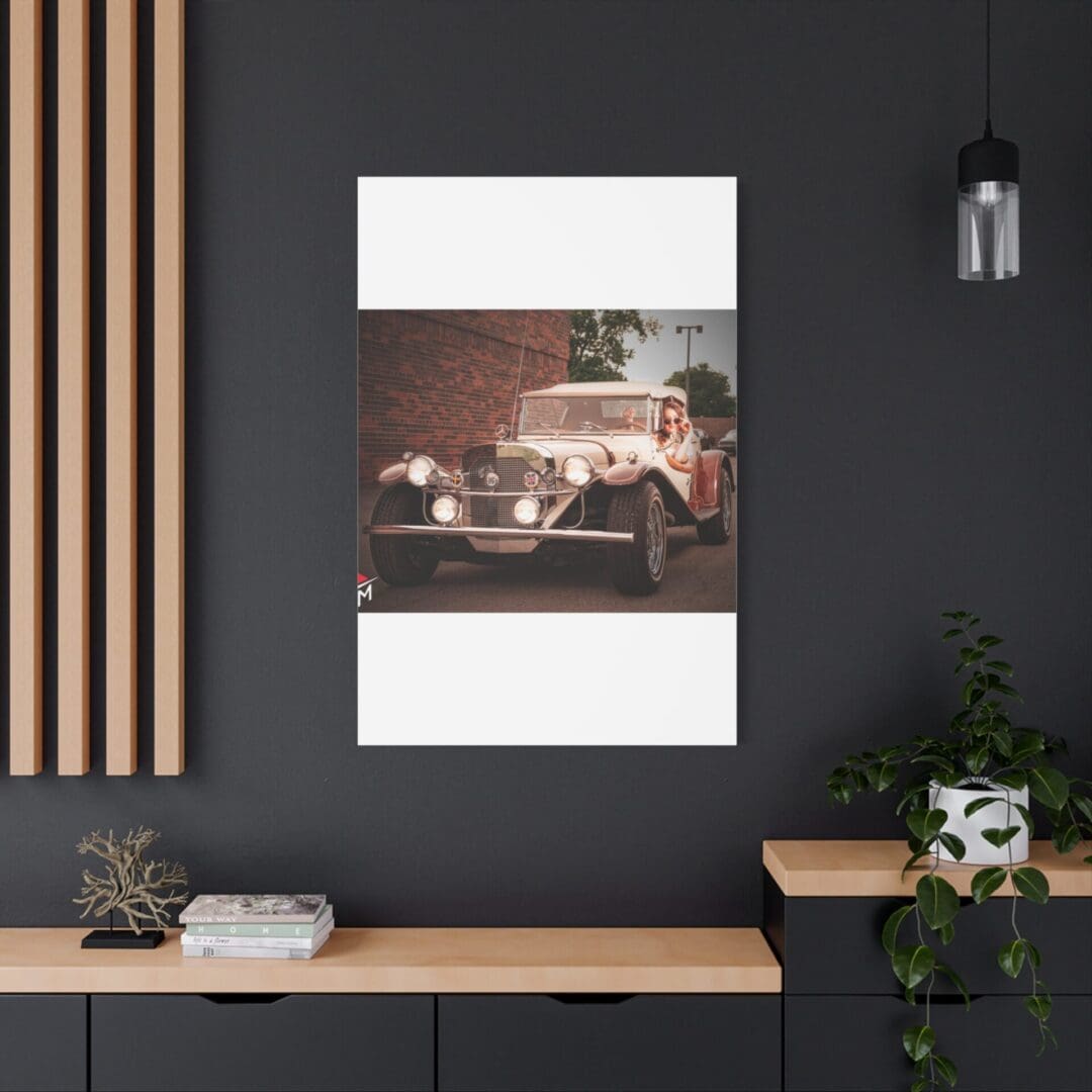Modern workspace with minimalist decor and a vintage car poster on dark wall.
