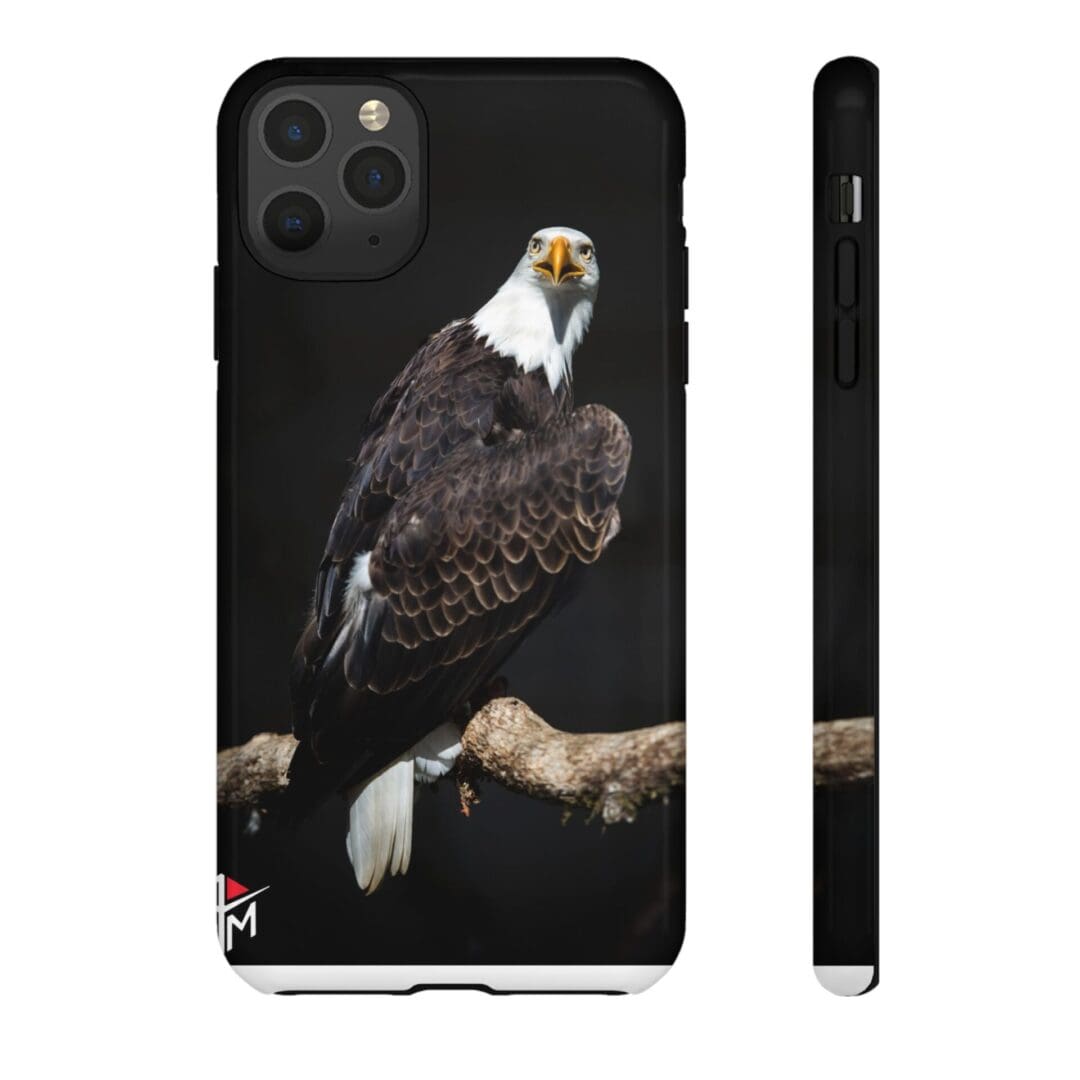 Black phone case with a bald eagle perched on a branch.