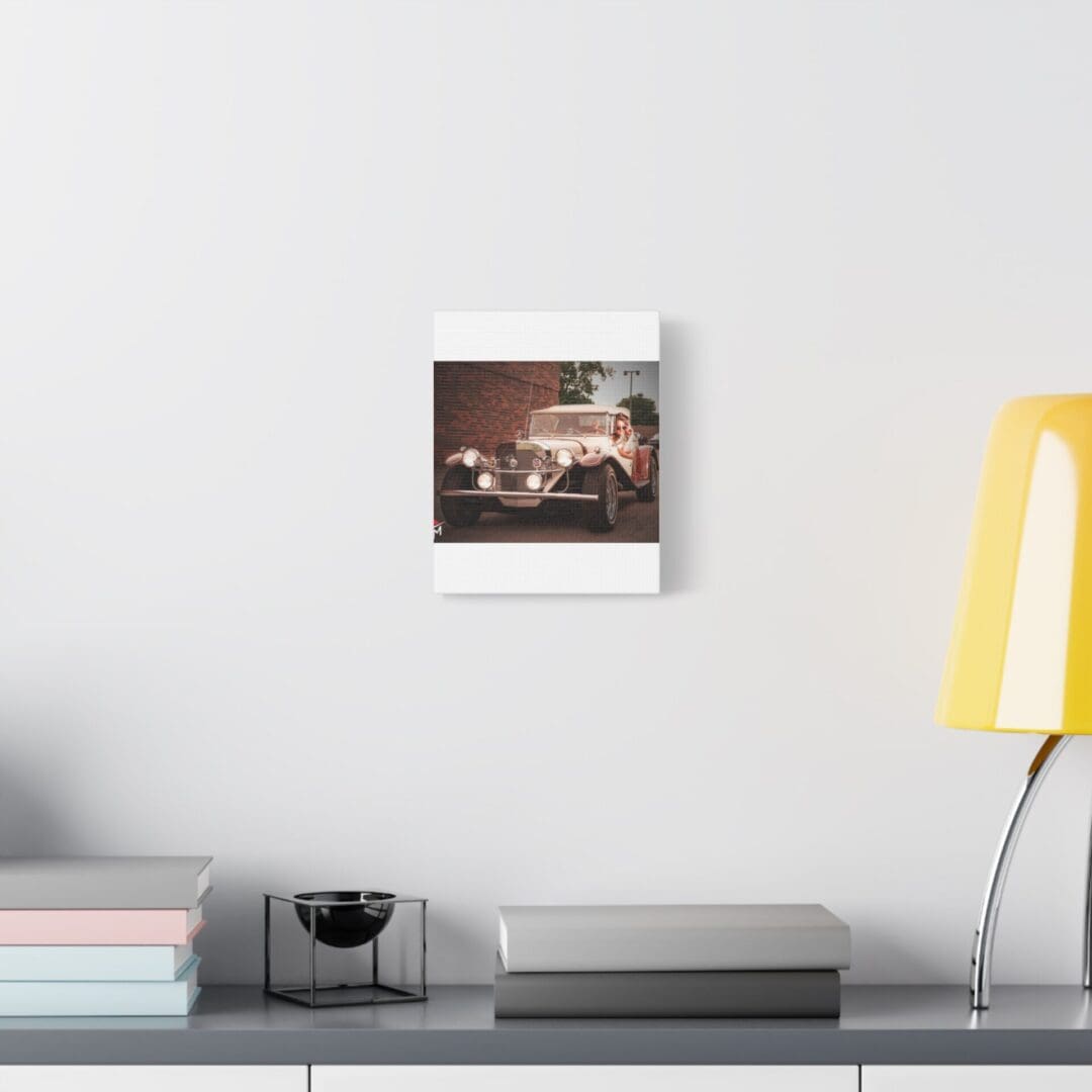 Minimalist workspace with a mounted photo and yellow lamp.