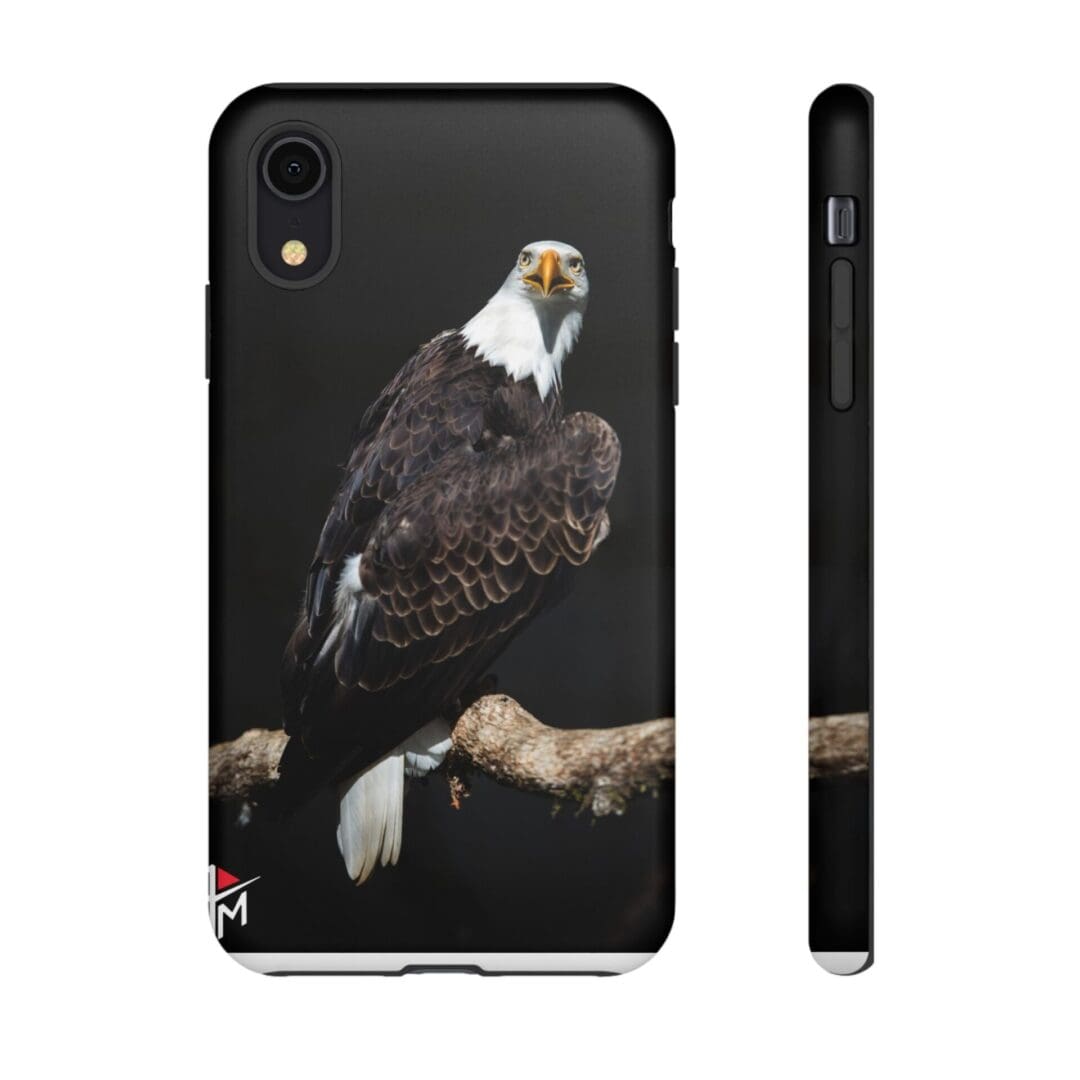 Black phone case with a detailed bald eagle perched on a branch.