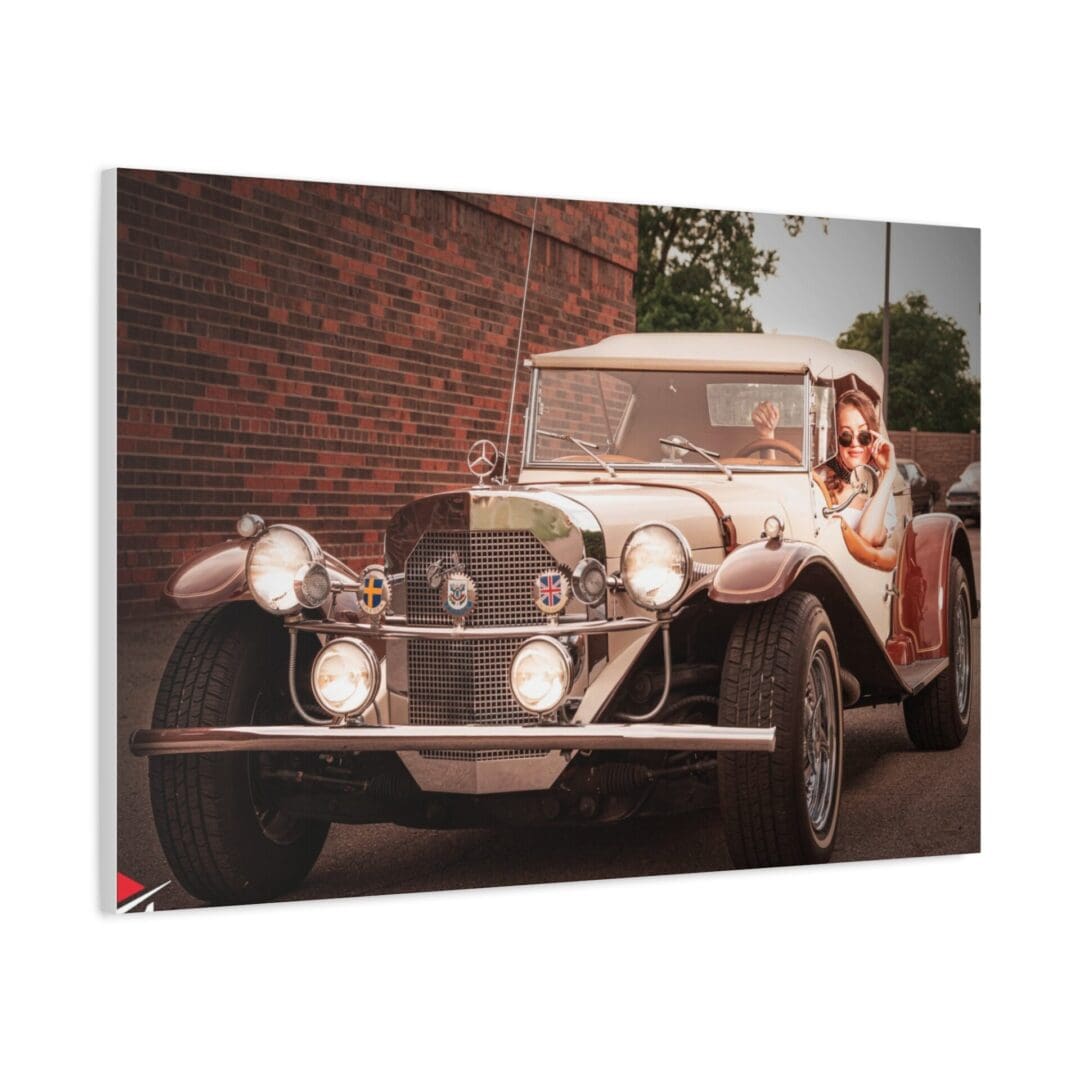 Vintage car parked on a street near a brick wall.