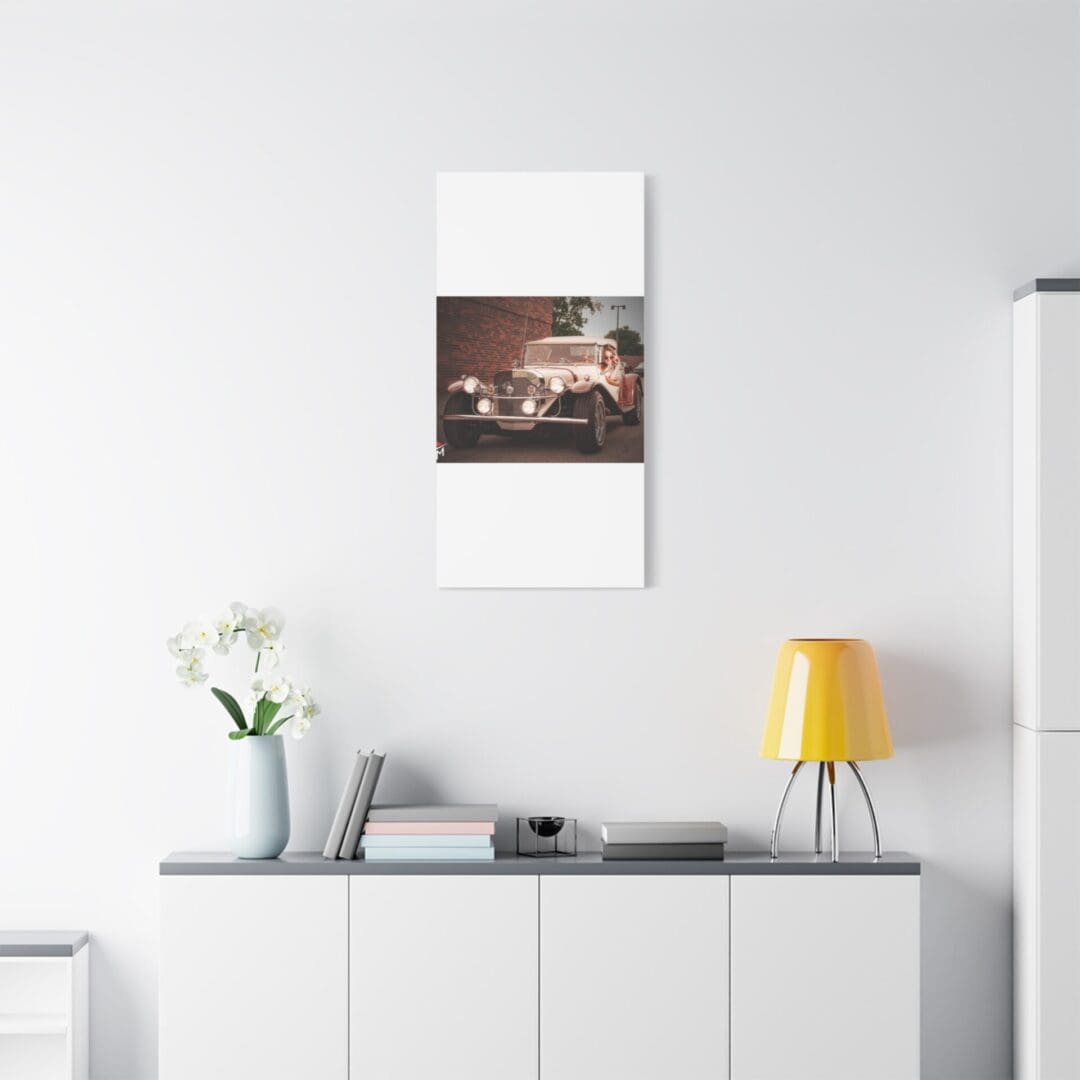 Minimalist interior with a calendar, yellow lamp, and white storage cabinet.
