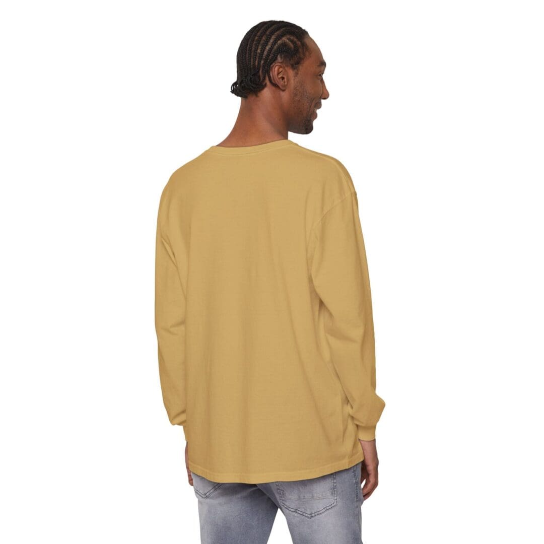 Man wearing a long-sleeve beige shirt, facing away.