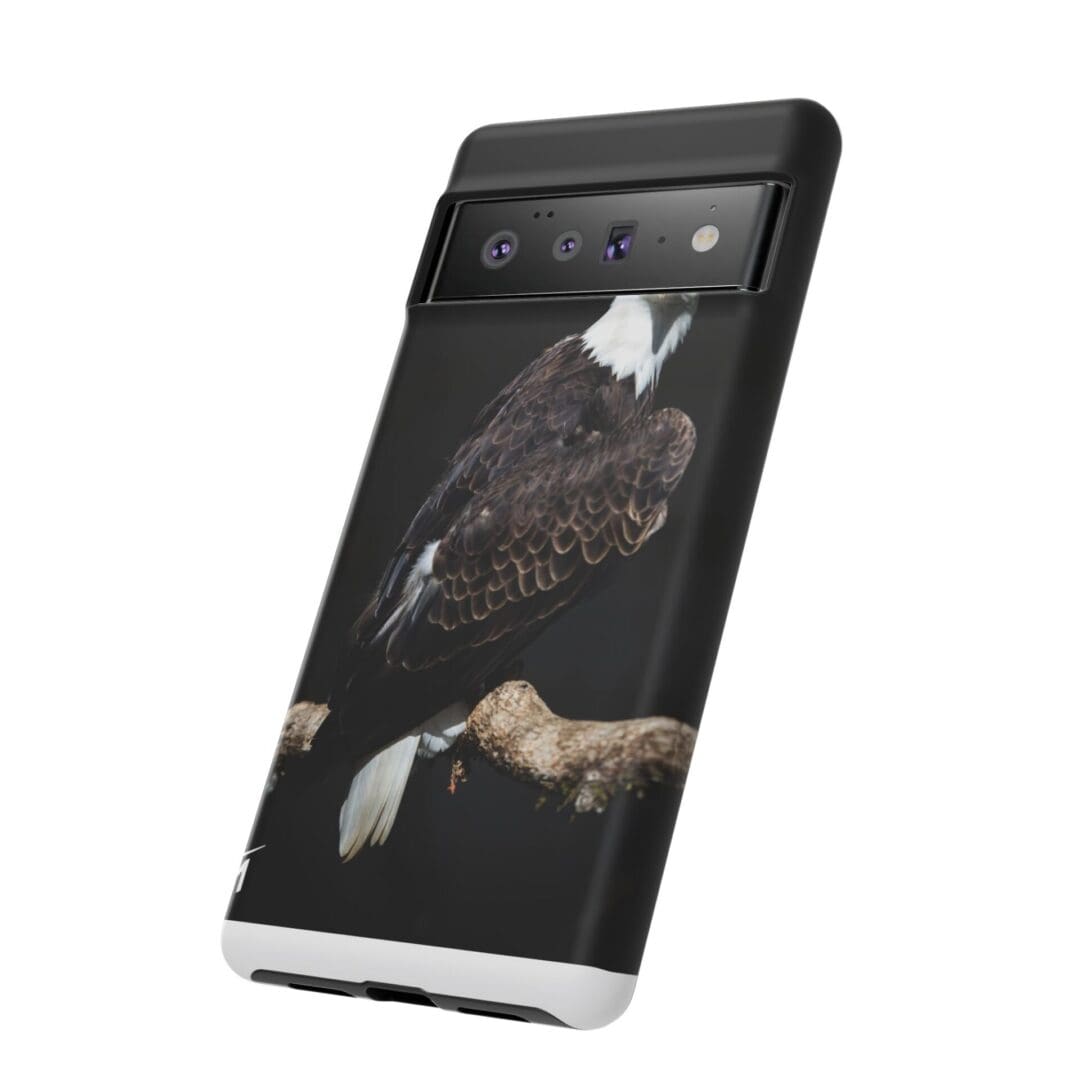 Smartphone with a cracked screen showing a dark background and some icons.