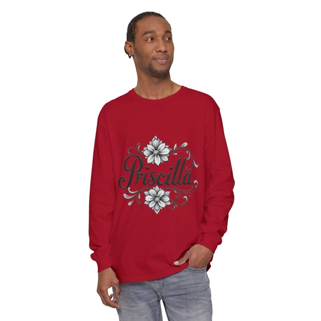 Man wearing a red sweater with a white and blue snowflake pattern.