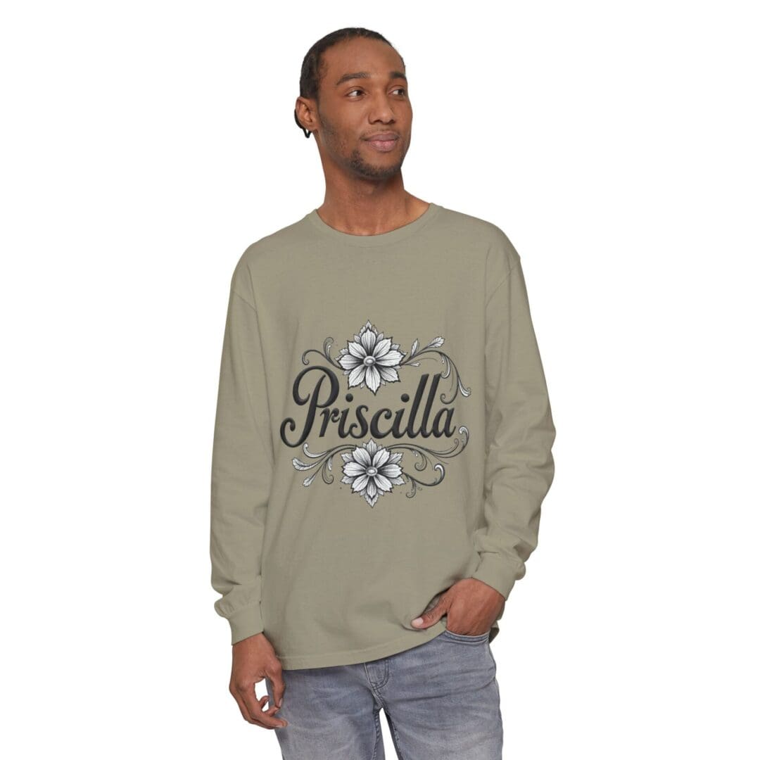 Man wearing a green long-sleeve shirt with 'Priscilla' text and floral design.
