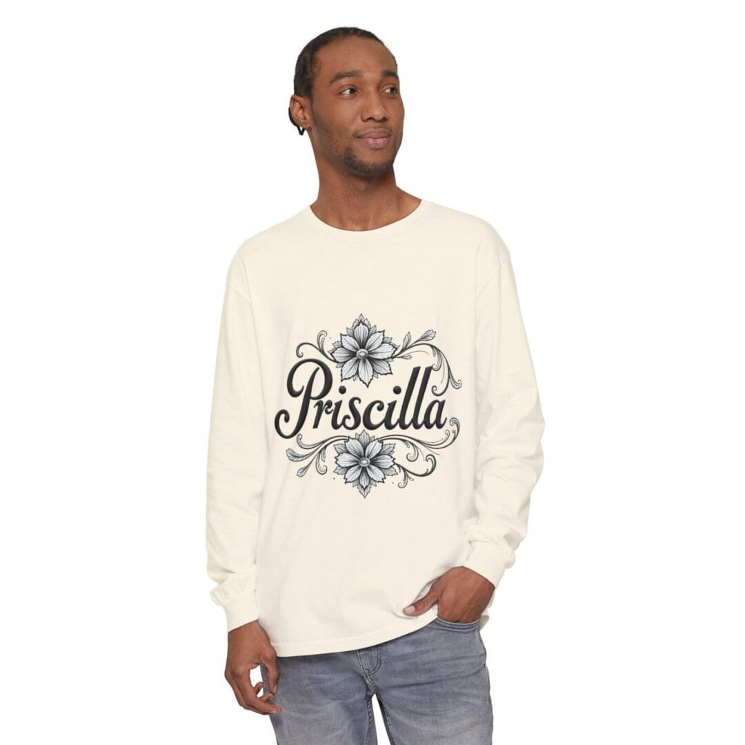 Man wearing a white long-sleeve shirt with 'Priscilla' printed on it.