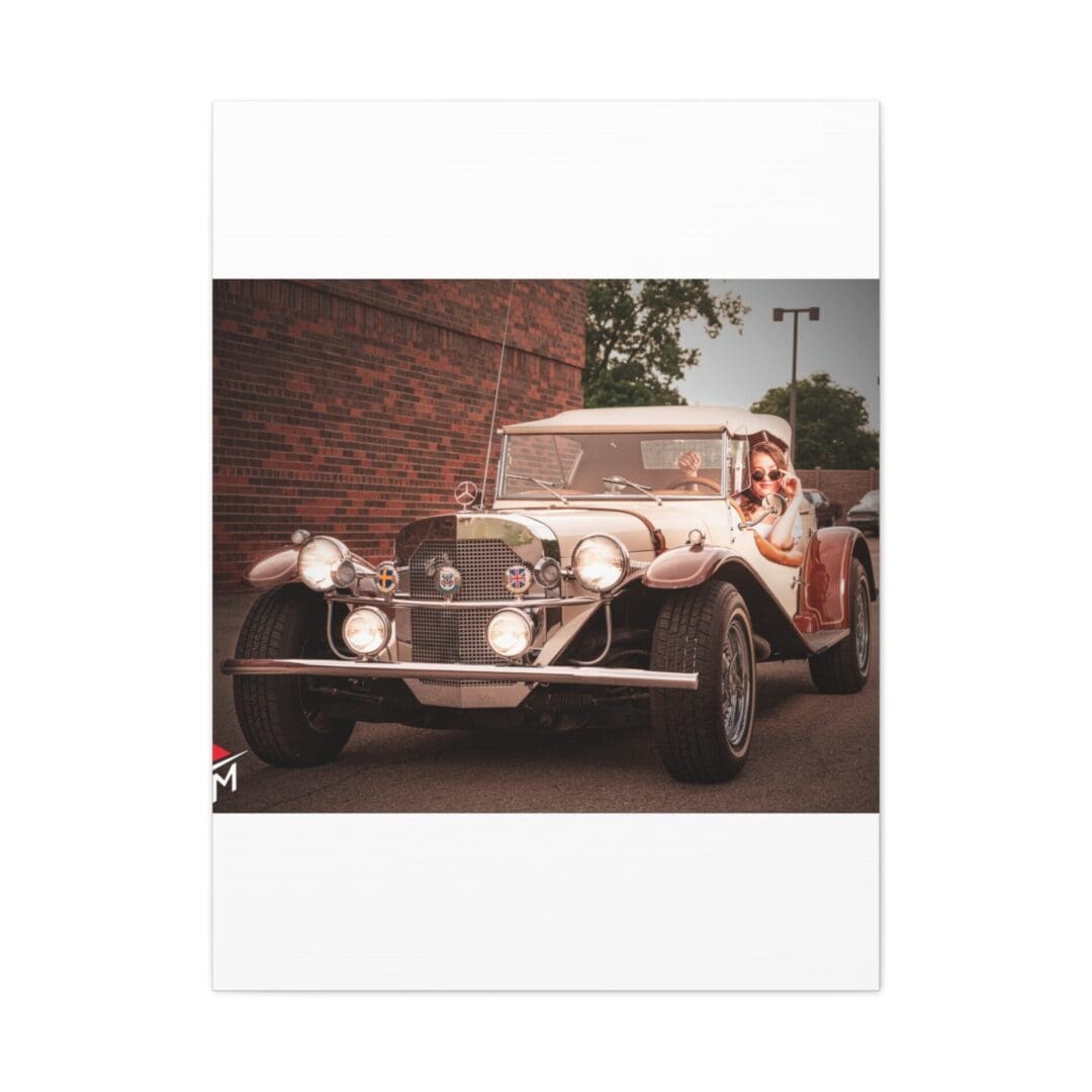 Vintage car parked near a brick wall.