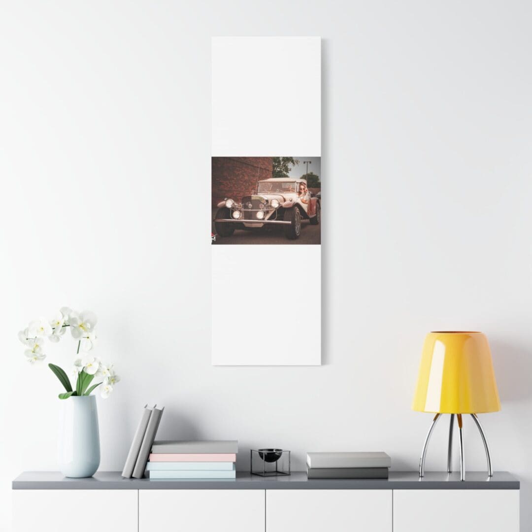 Modern white wall art above a minimalist desk with a yellow lamp.