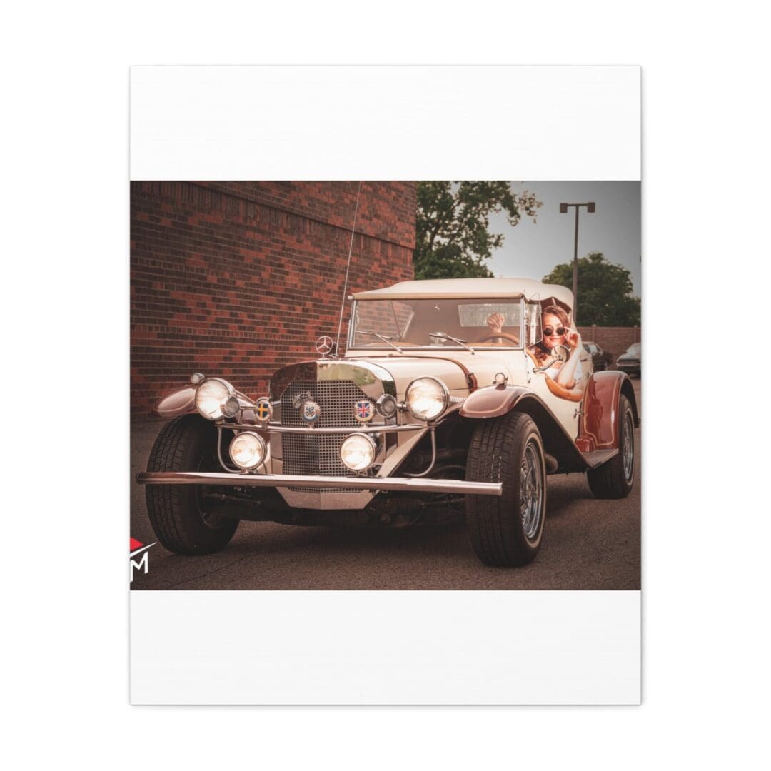 A vintage car parked beside a brick building on a sunny day.