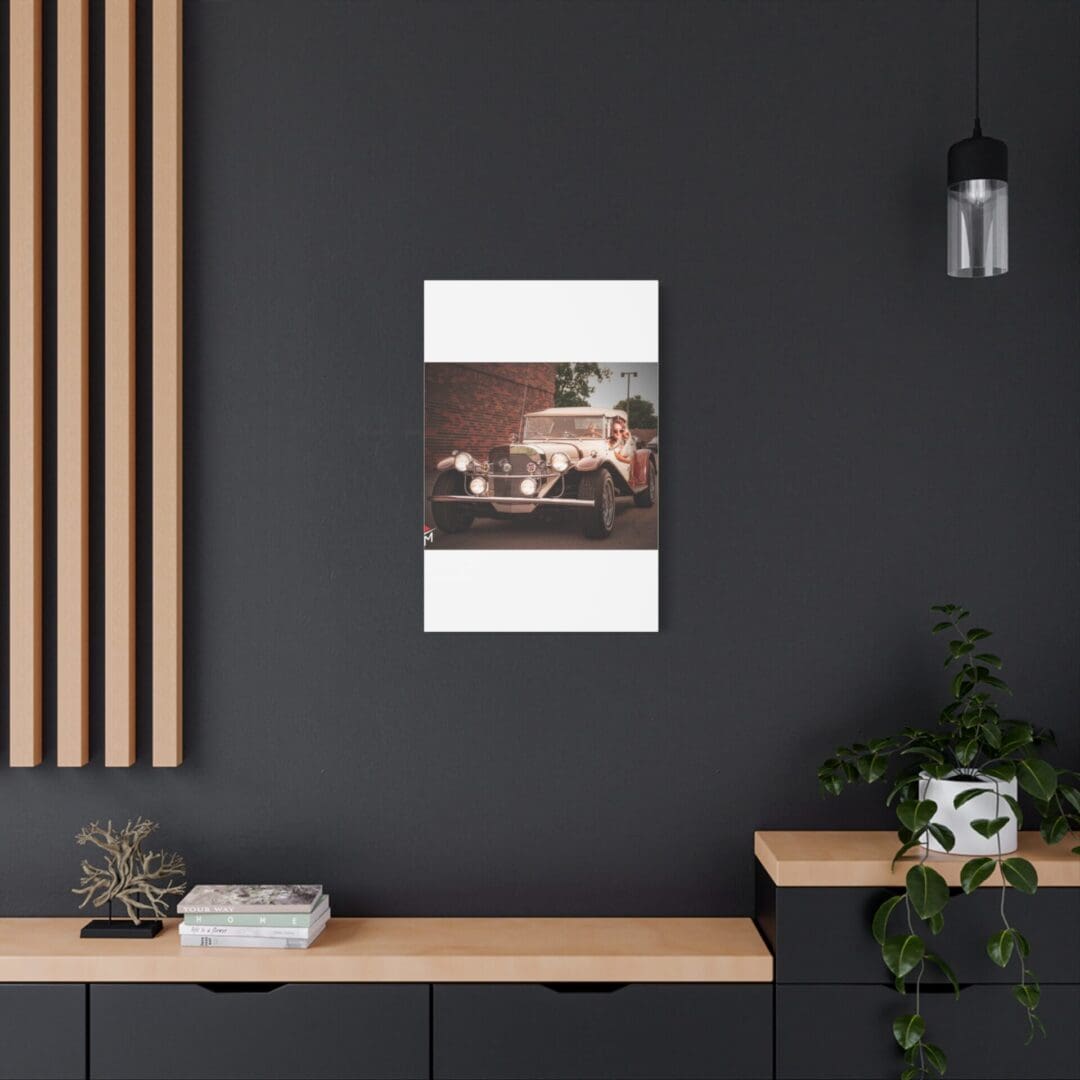 Modern workspace with dark walls, wood accents, and a framed abstract photo.