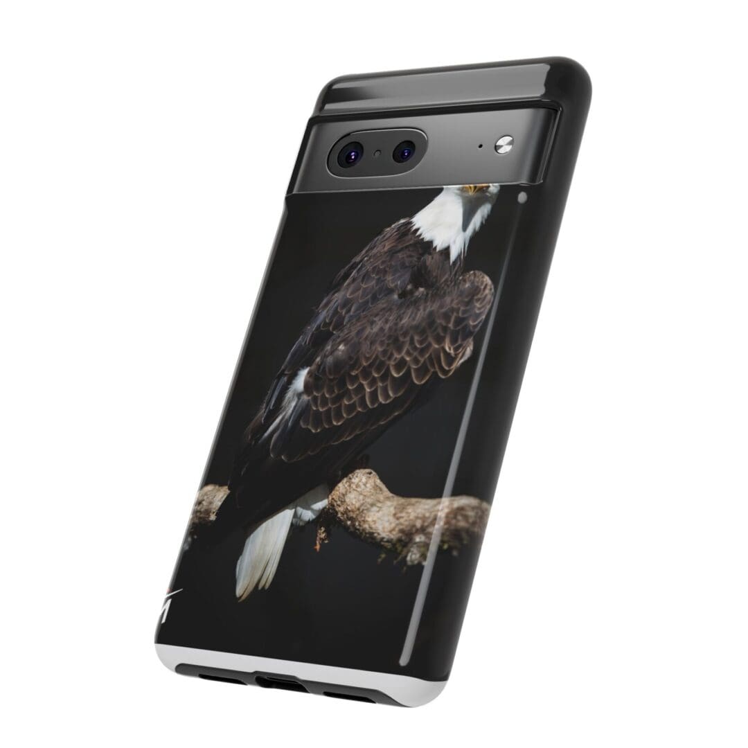 A smartphone with a dark artistic wallpaper featuring a mysterious figure.