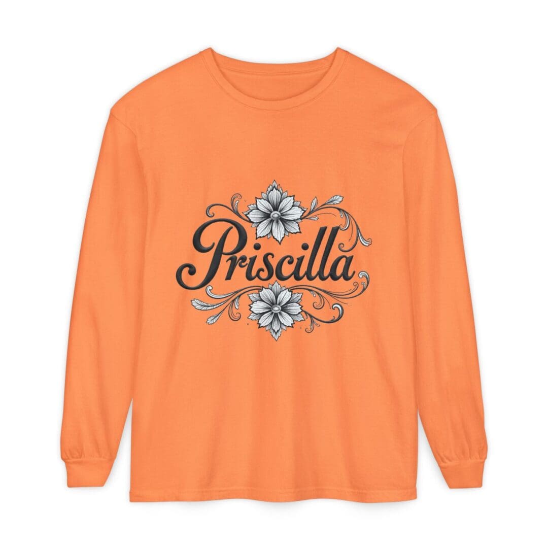 Orange long-sleeve shirt with floral and text design.
