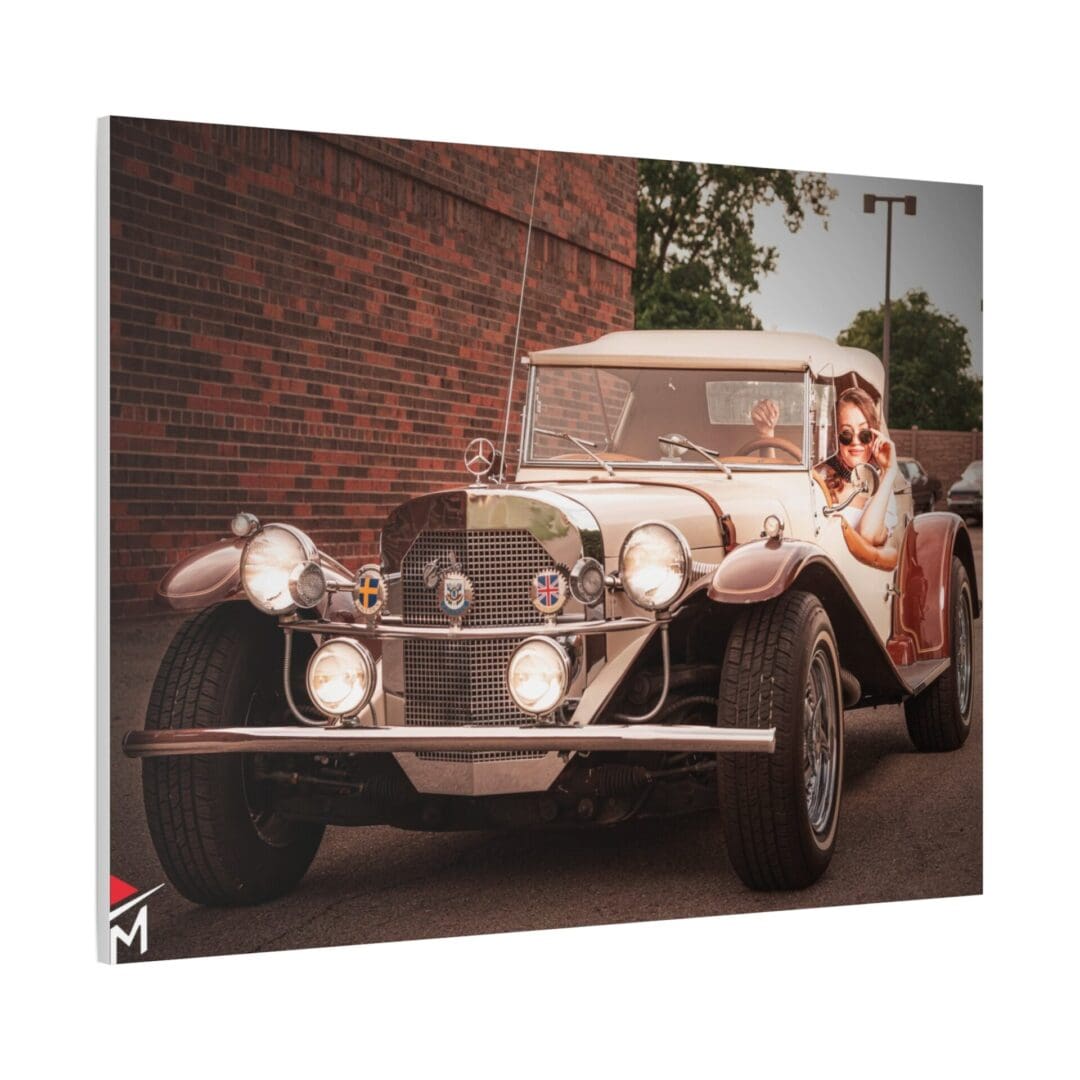 Vintage car parked beside a brick wall on a sunny day.