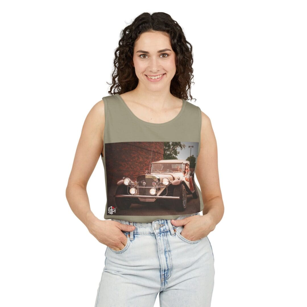 Woman holding a square photo of a truck driving at night.