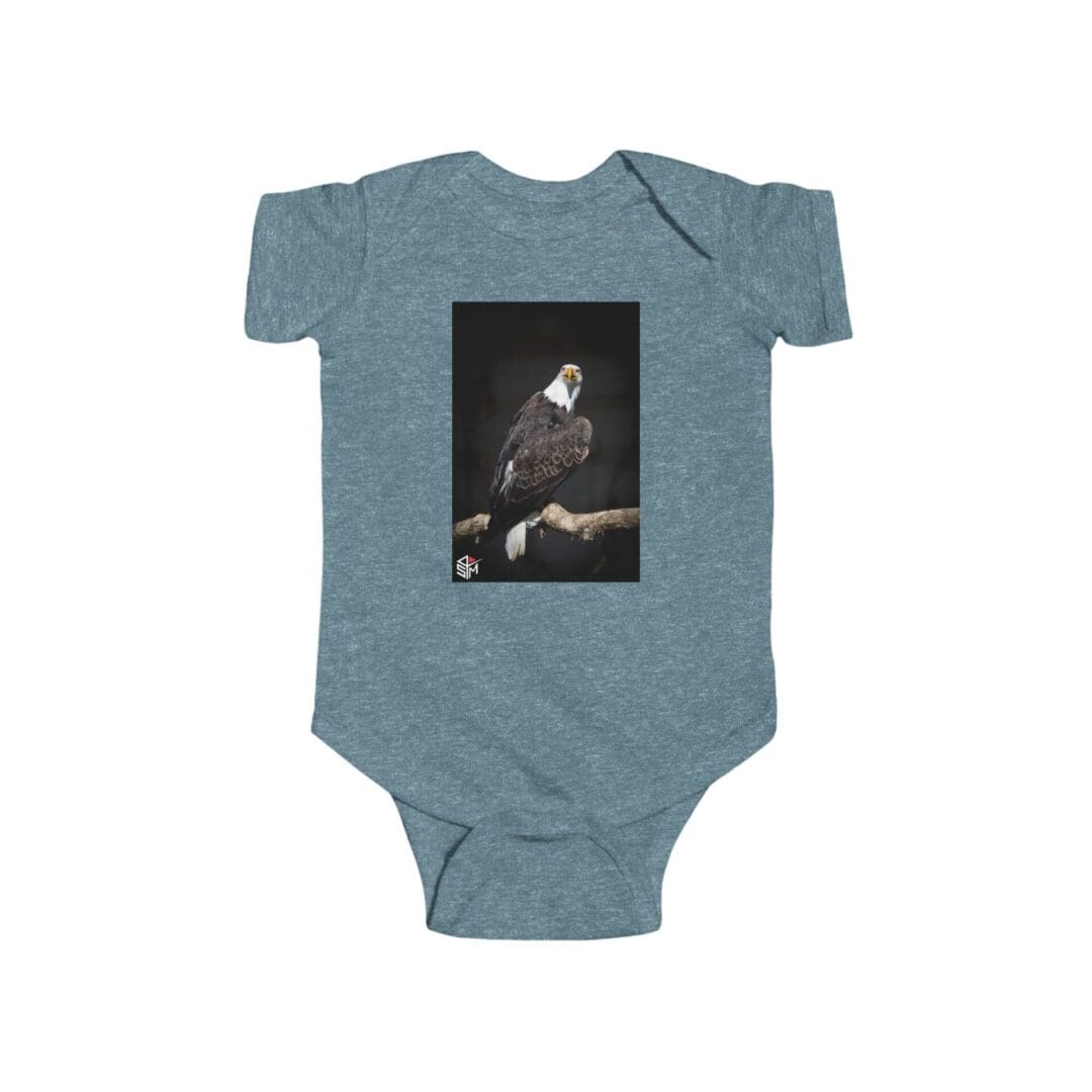 Blue baby onesie with a black-and-white photo of a musician playing guitar.