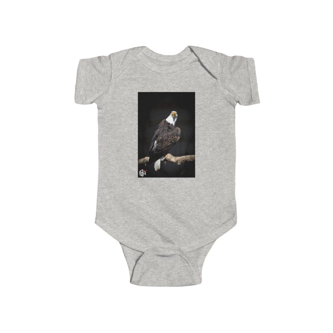 Grey baby onesie with a dark artistic print on the front.