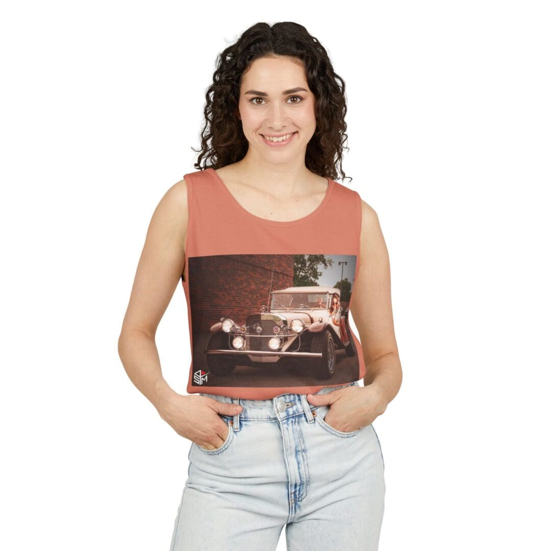 Woman holding a framed photo of a cityscape at night.