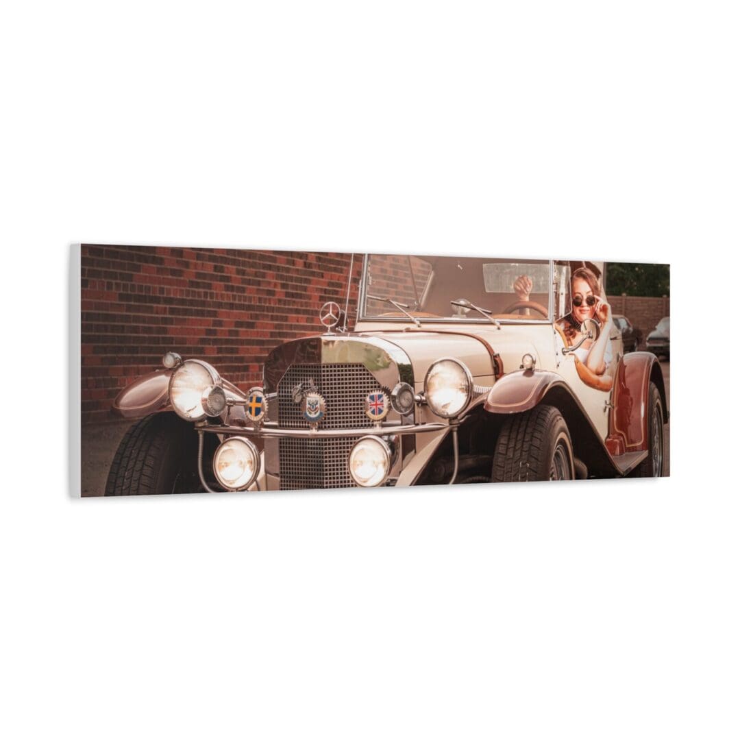 Vintage car with a woman reclining on it in an art piece.