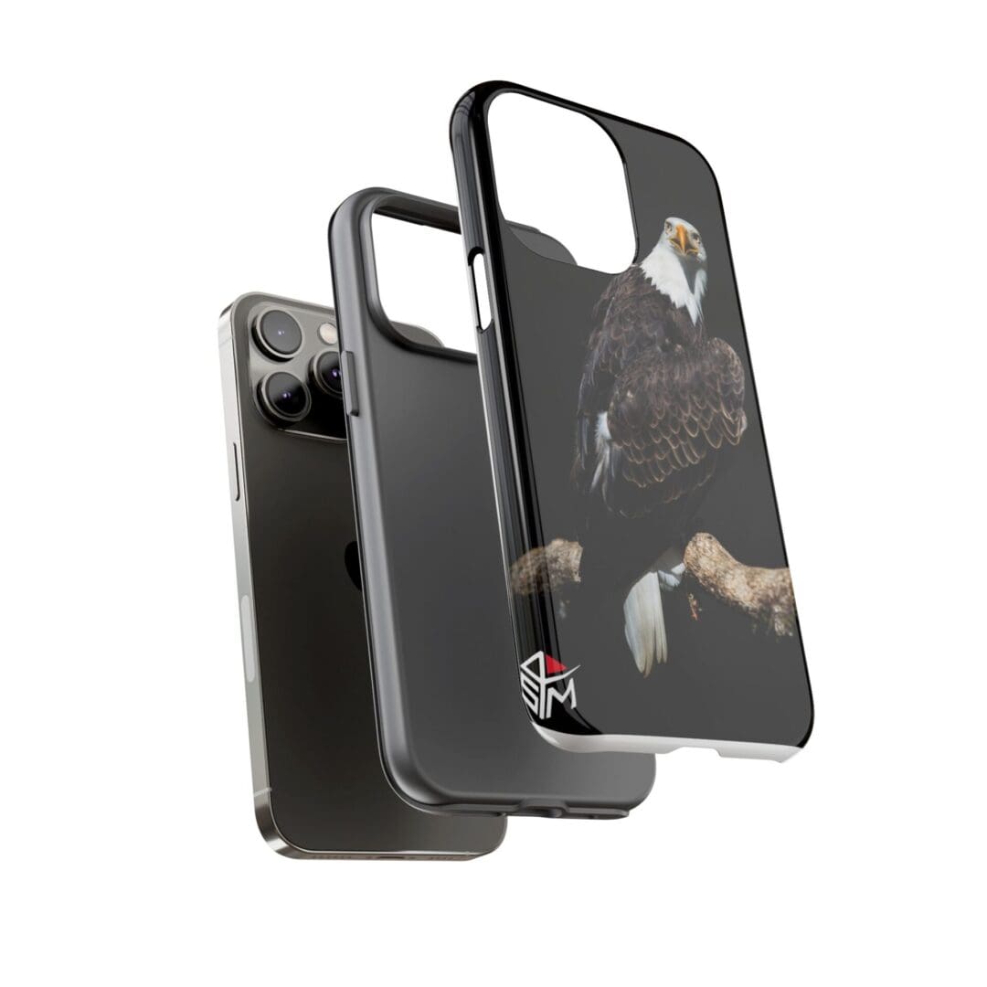 A smartphone with a black protective case featuring a cat design.