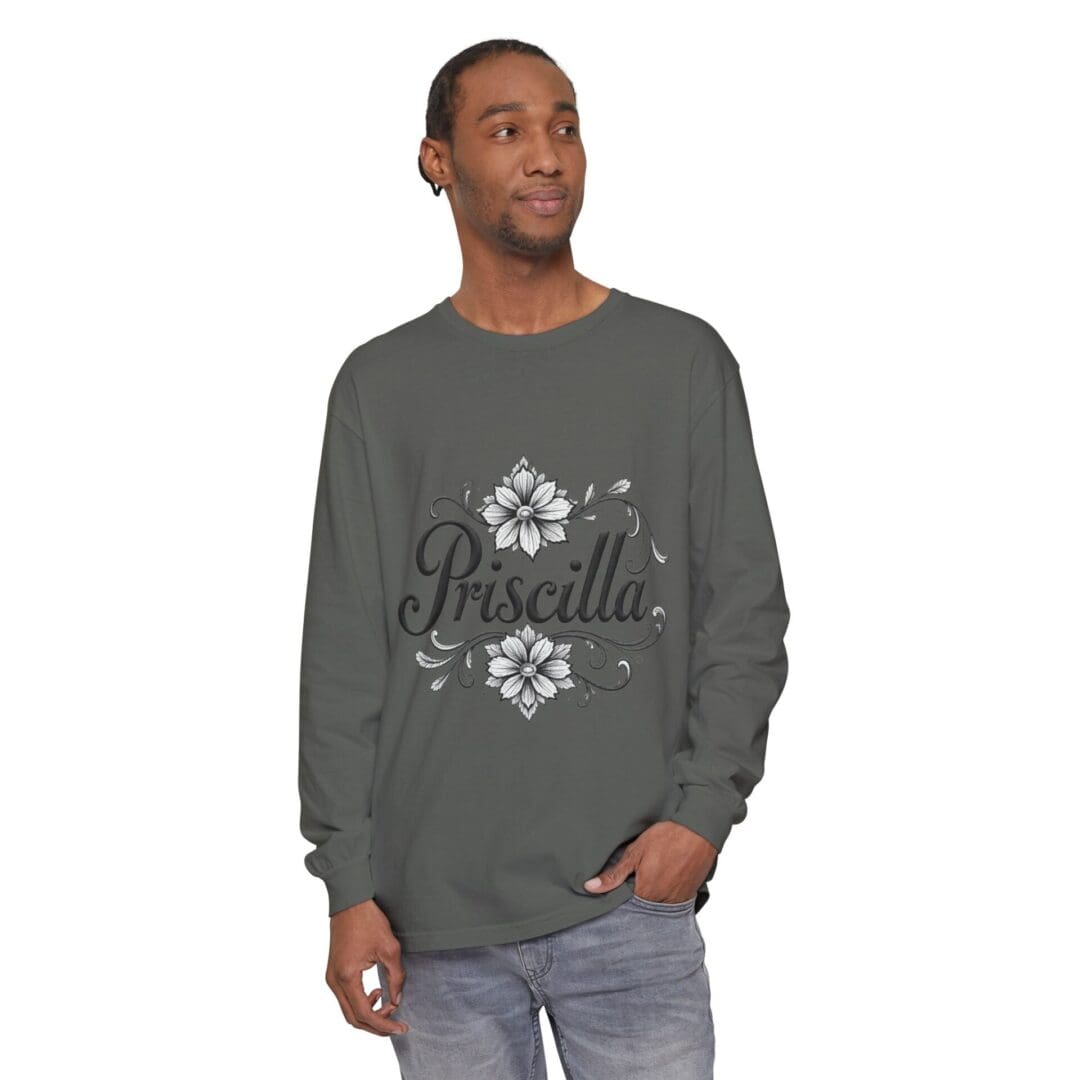 Man wearing a gray sweatshirt with a white floral pattern.