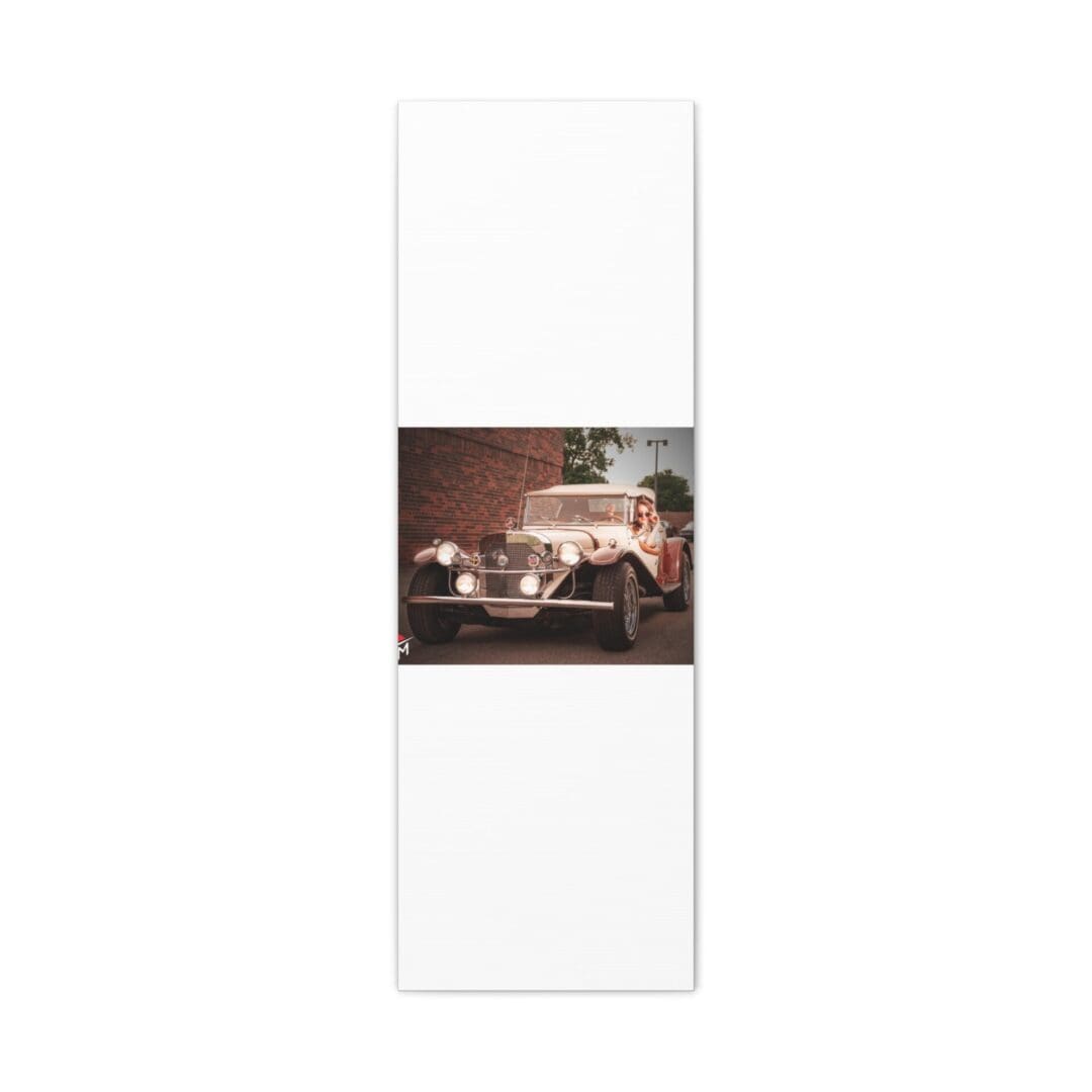 Tall white cabinet with a vintage car photo on the middle door.