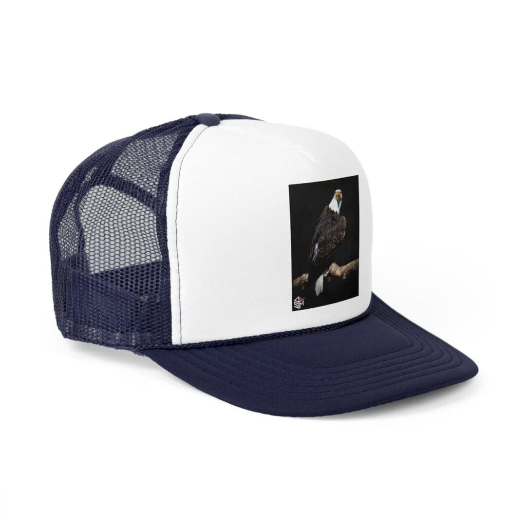 A navy and white mesh trucker hat with a small rectangular photo on the front.