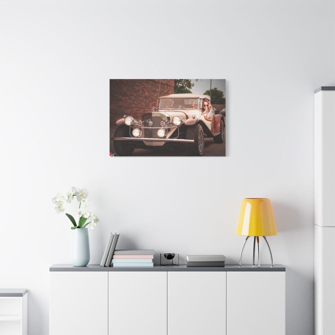Modern living room with a sleek white cabinet and abstract art on the wall.