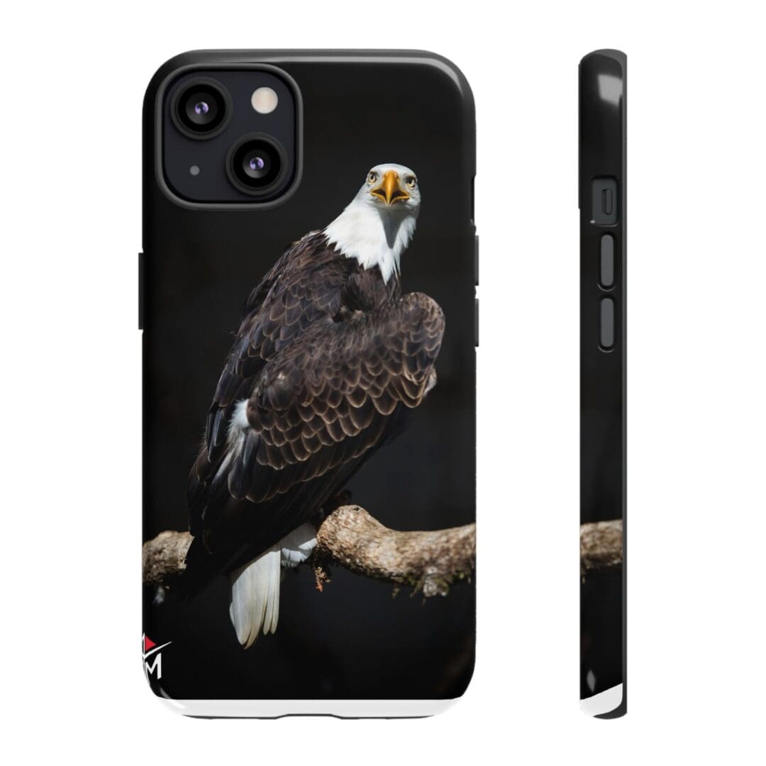A phone case featuring a detailed bald eagle perched on a branch.