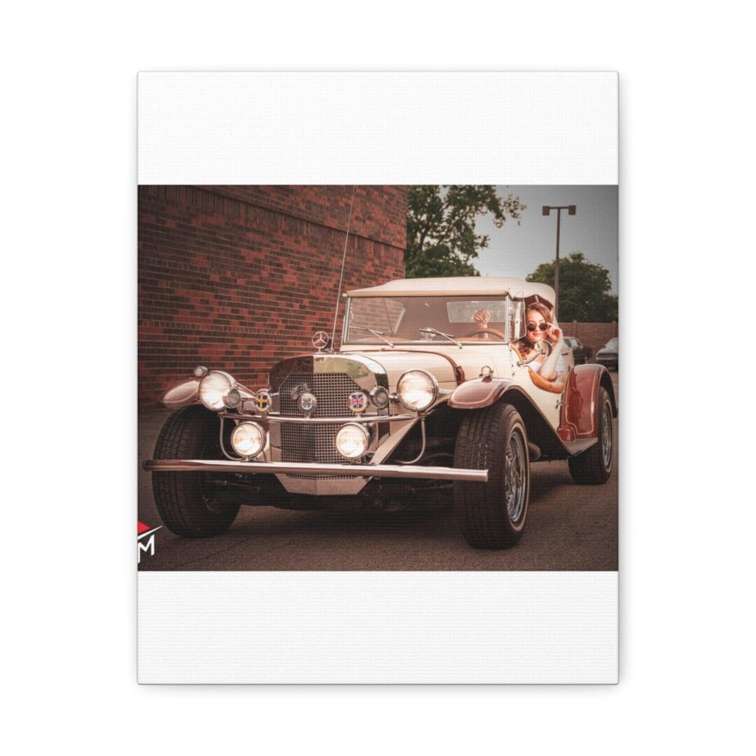 Vintage classic car parked near a brick wall on a street.