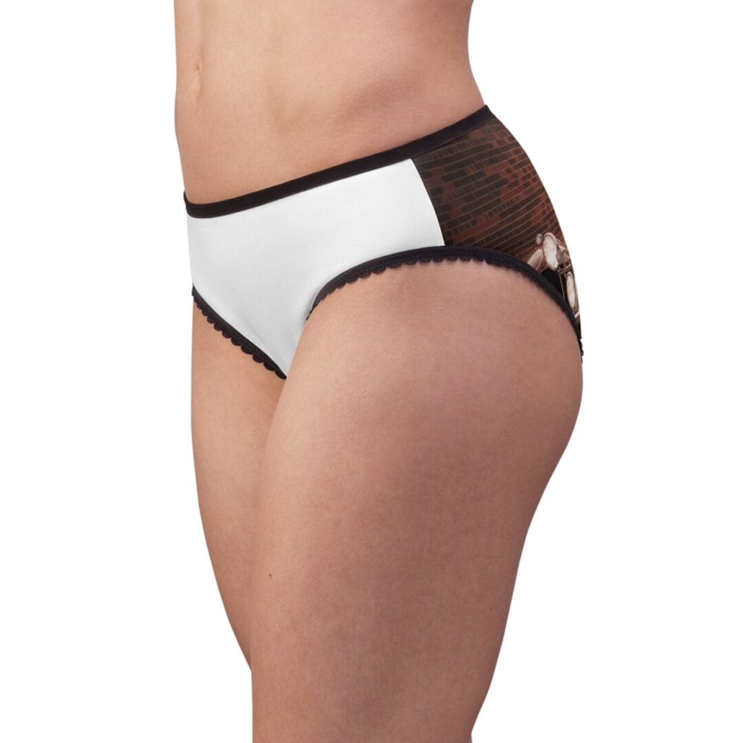 Side view of a person wearing black and white patterned underwear.