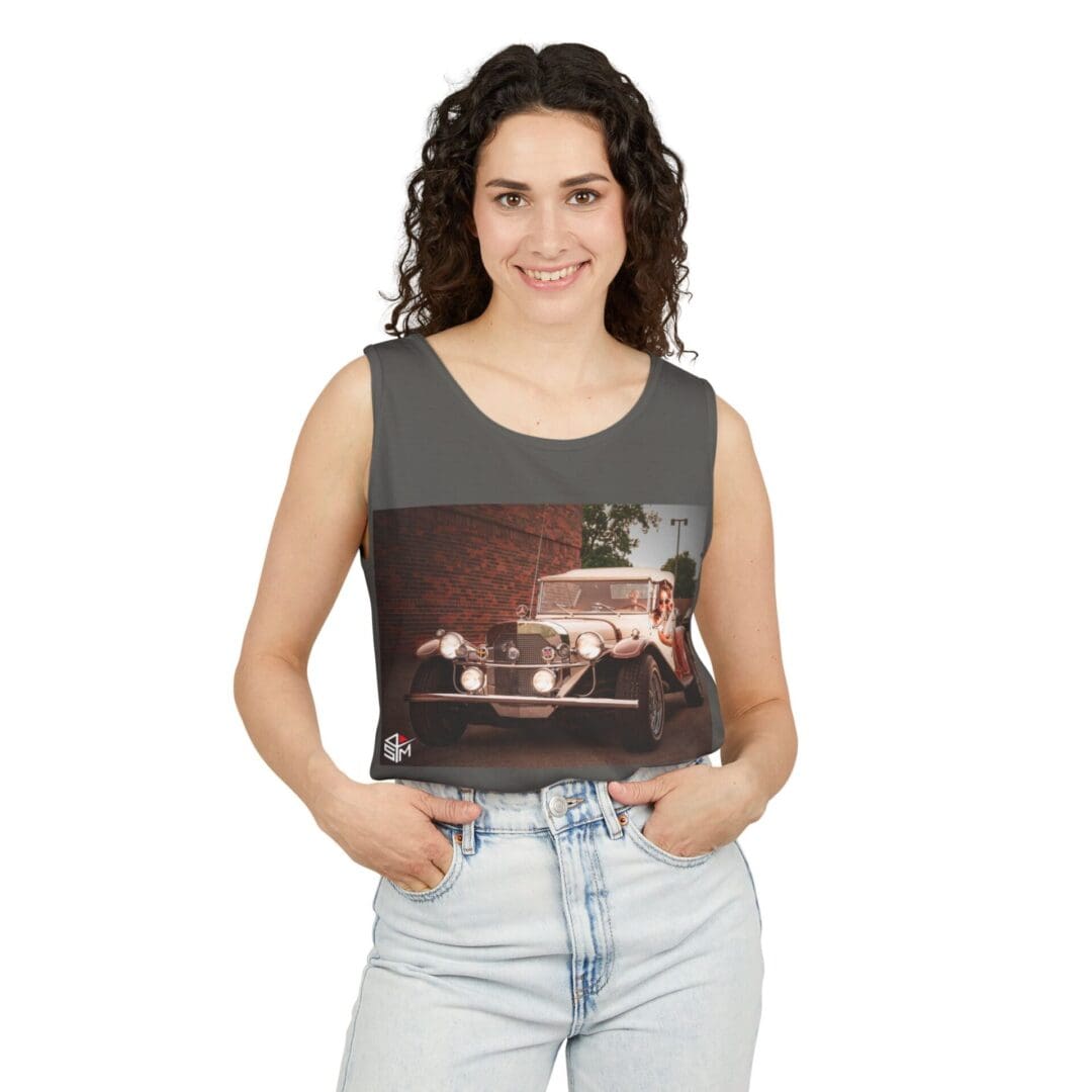 Smiling woman wearing a sleeveless top with a cityscape print and light jeans.