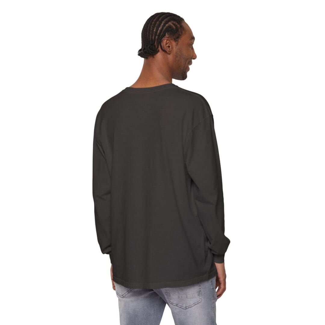 Man wearing a plain black long-sleeve shirt, seen from the back.