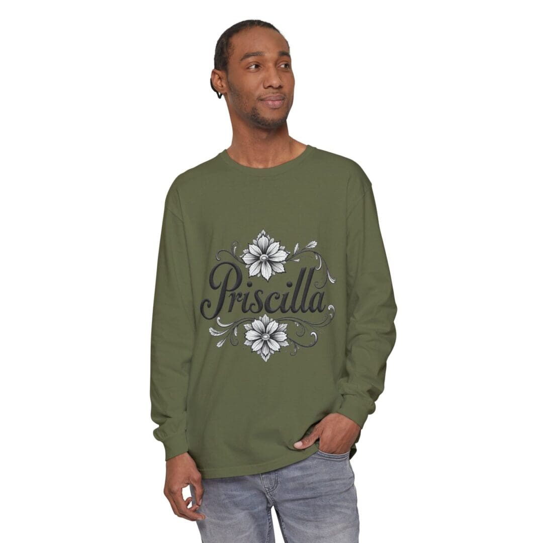 Man wearing an olive green sweatshirt with a white floral design.