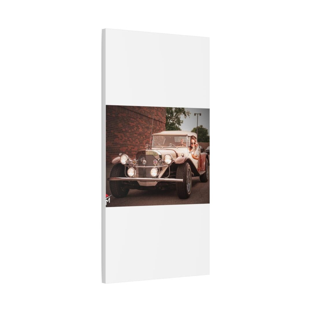 Elegant vintage car displayed in a modern, white-framed setting.