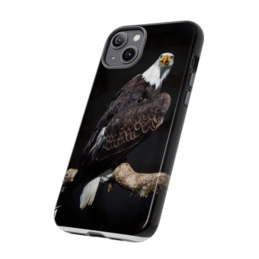 Phone case featuring a detailed bald eagle design on a black background.