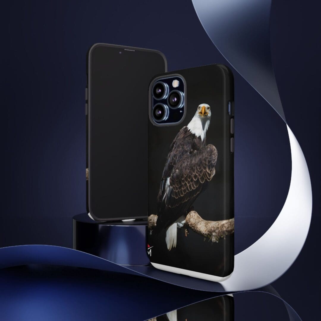 Black phone case with a detailed eagle design on the back.
