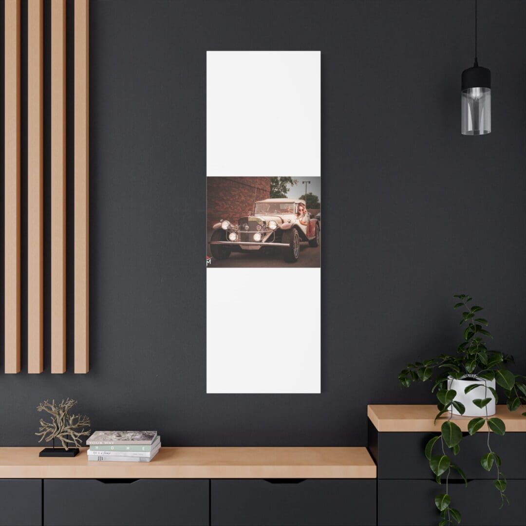 Modern interior with a vertical art piece on a dark wall above a wooden desk.