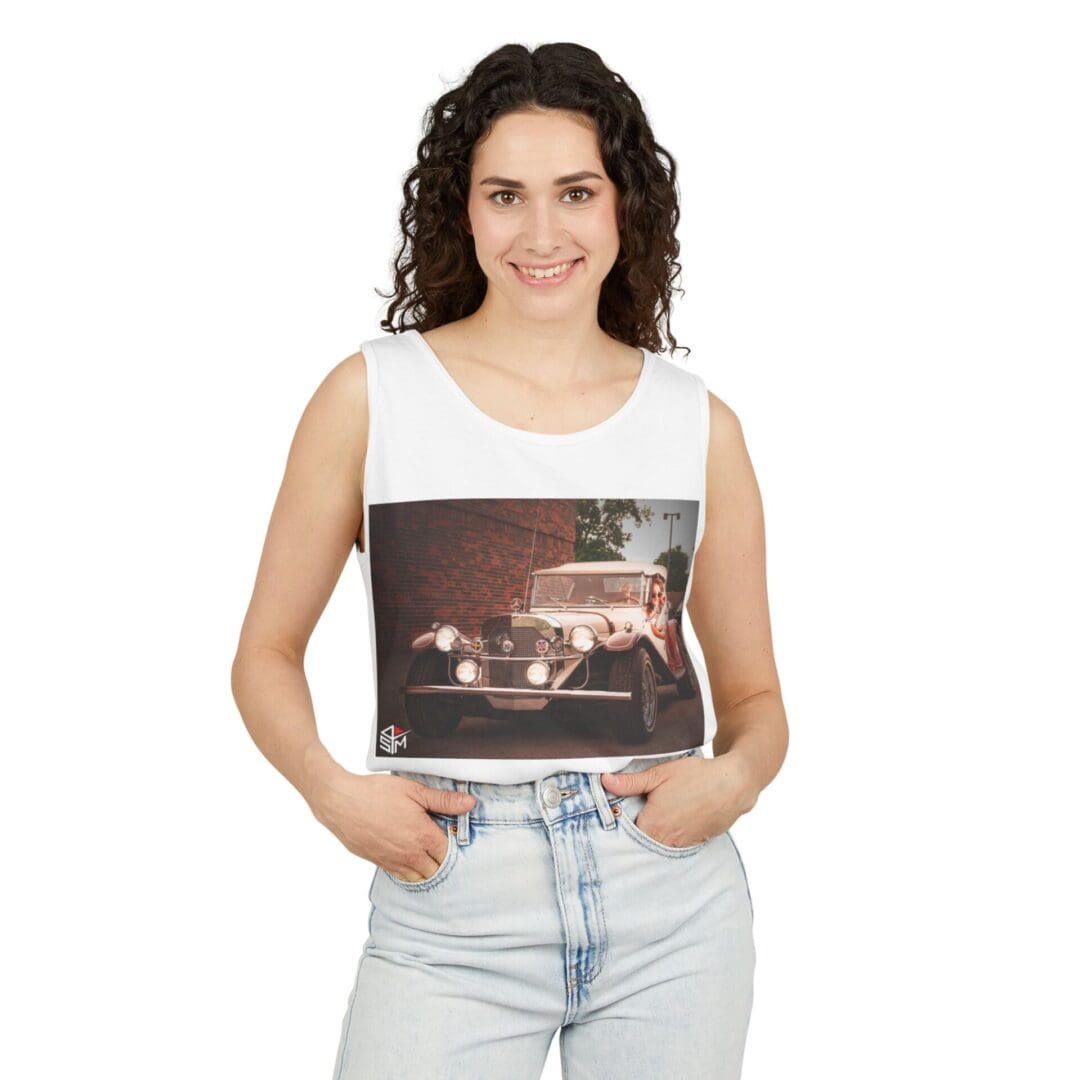 Woman holding a photo of a city street at night with car lights.