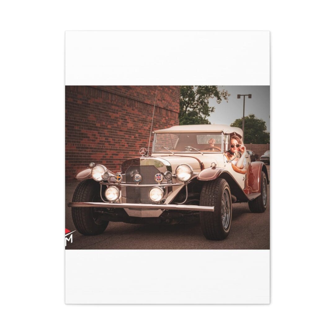 Vintage classic car parked by a brick wall.