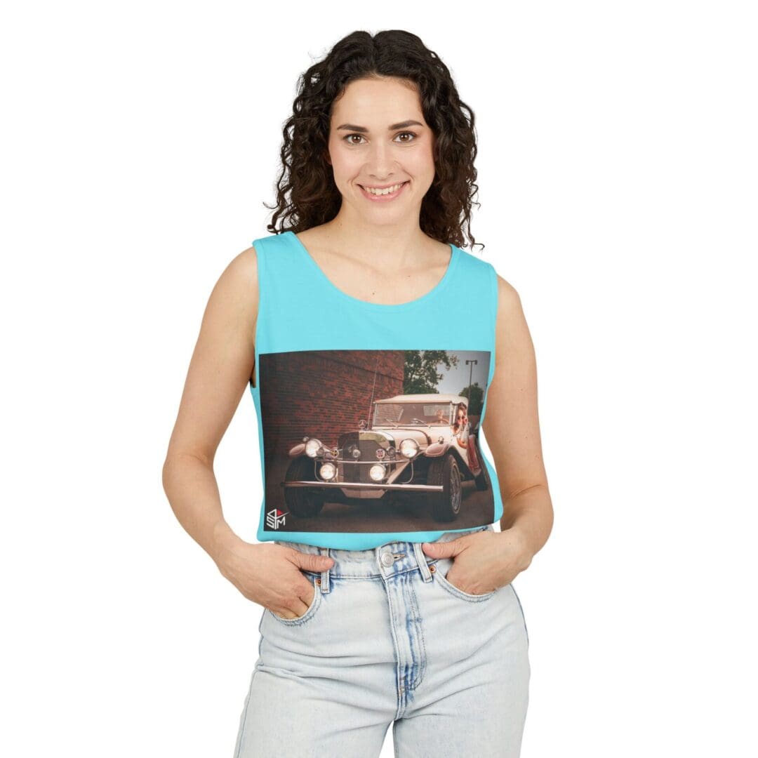 Woman wearing a sleeveless top with a vintage car print.
