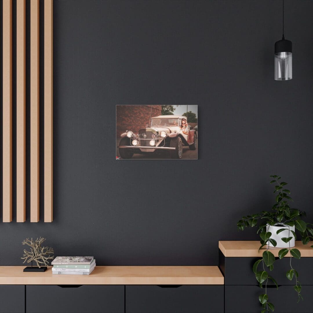 Modern workspace with minimalist decor and vintage car photo.