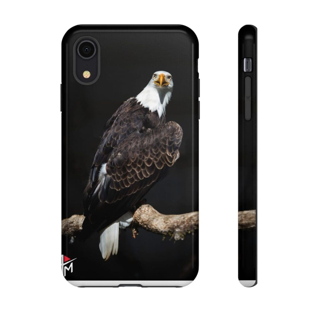 Phone case featuring a detailed bald eagle perched on a branch.
