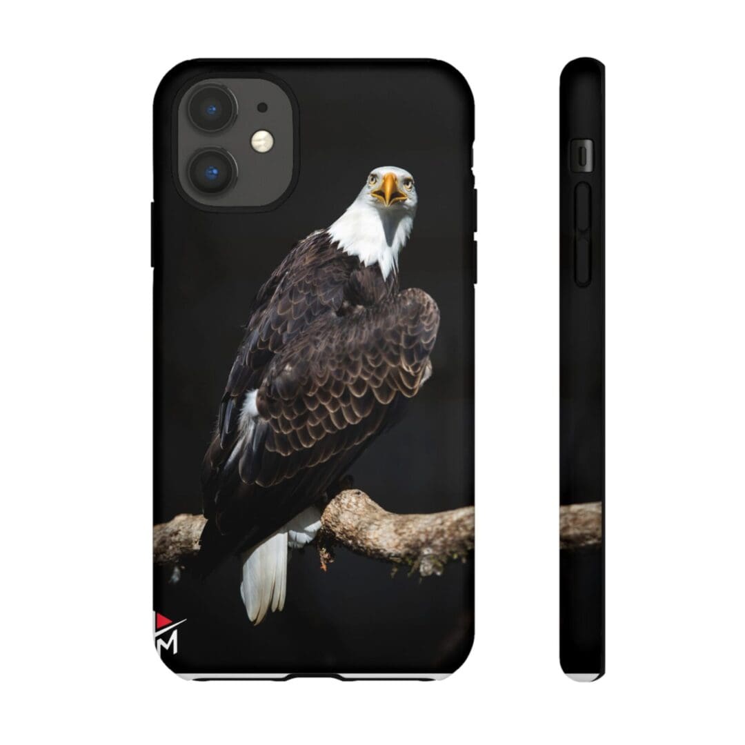 Phone case featuring a detailed bald eagle perched on a branch against a black background.
