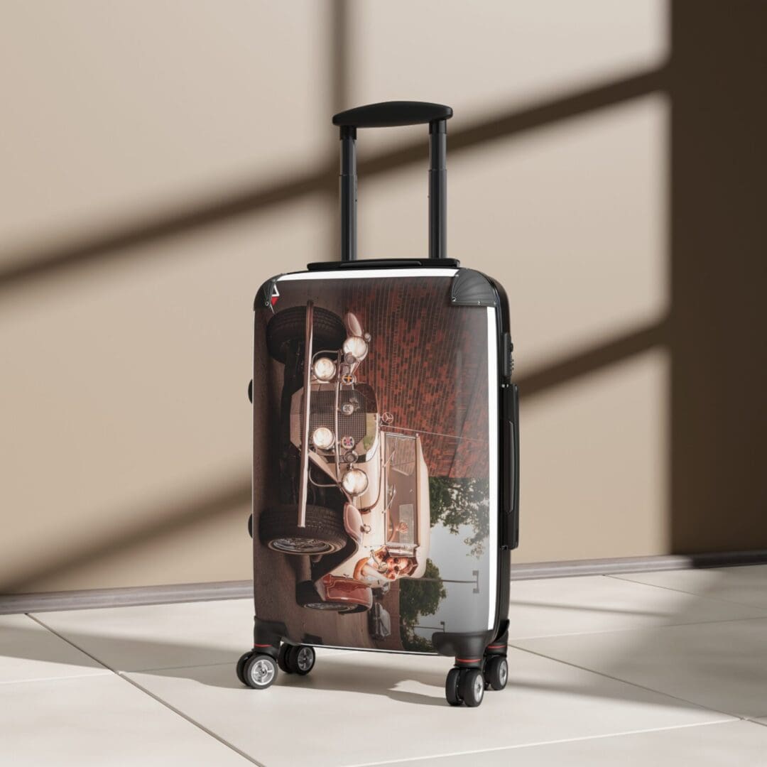 A suitcase with an artistic print stands in soft sunlight indoors.