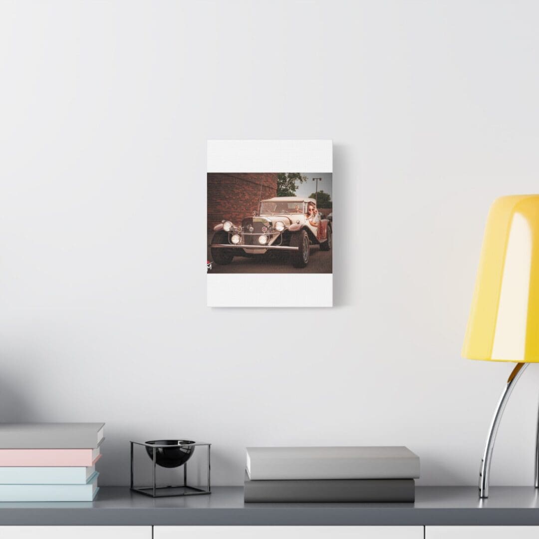 Minimalist desk setup with a calendar, lamp, and camera.