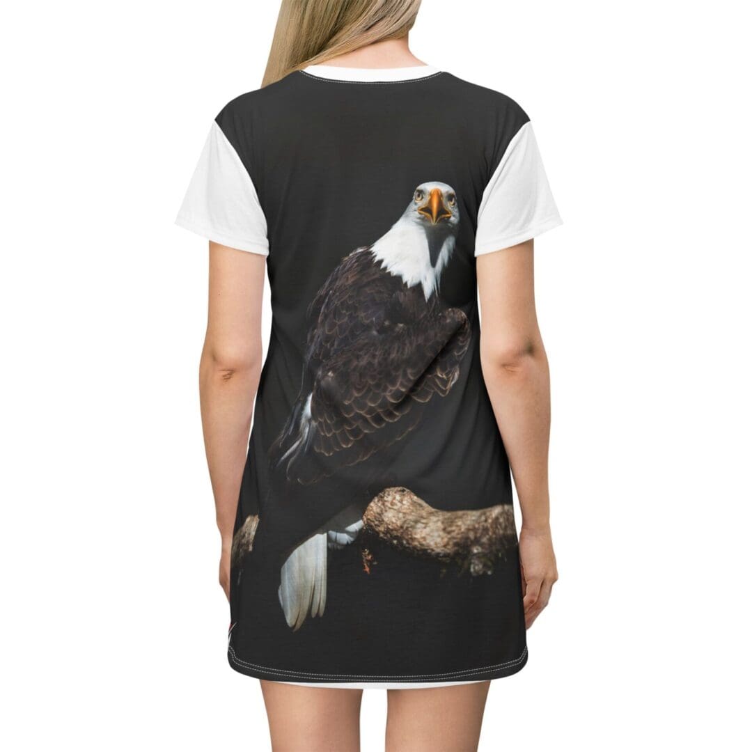 Woman wearing a dress with a large eagle print on the back.