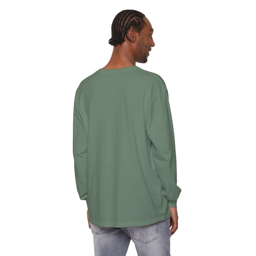 Person wearing a loose green long-sleeve shirt, viewed from the back.