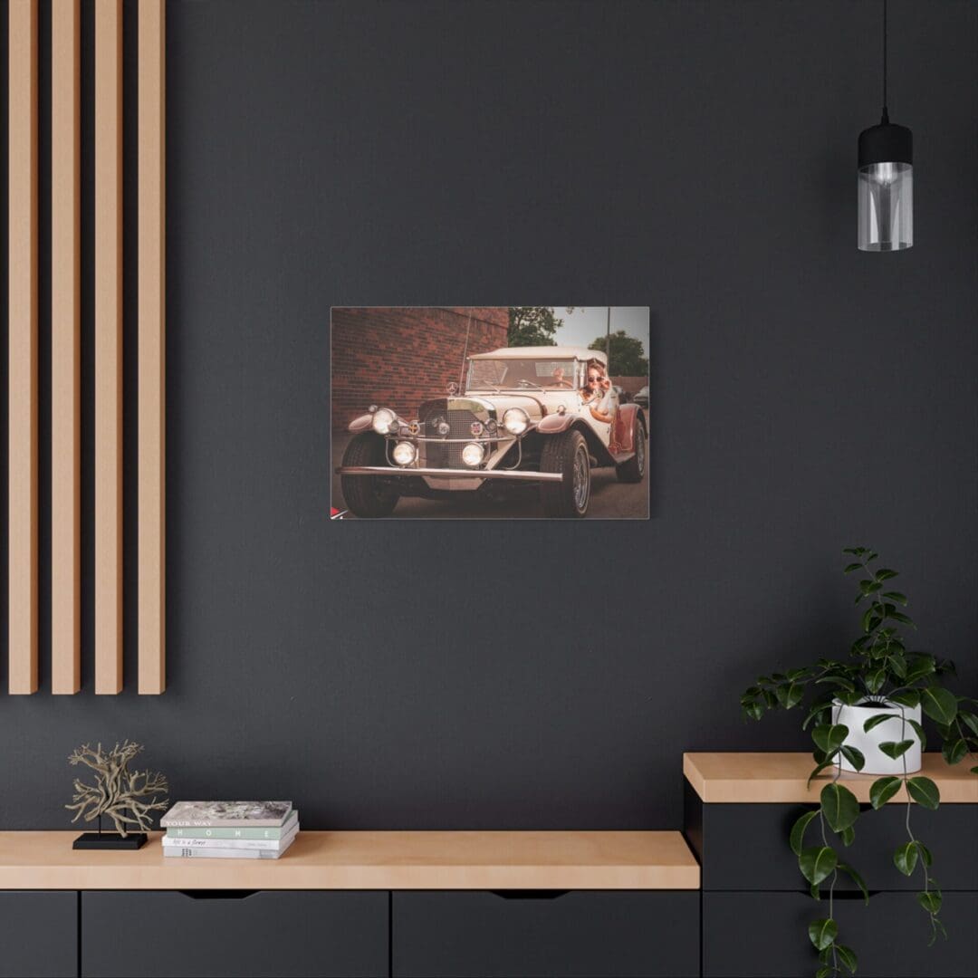 Modern office space with dark walls, wood accents, and vintage car artwork.