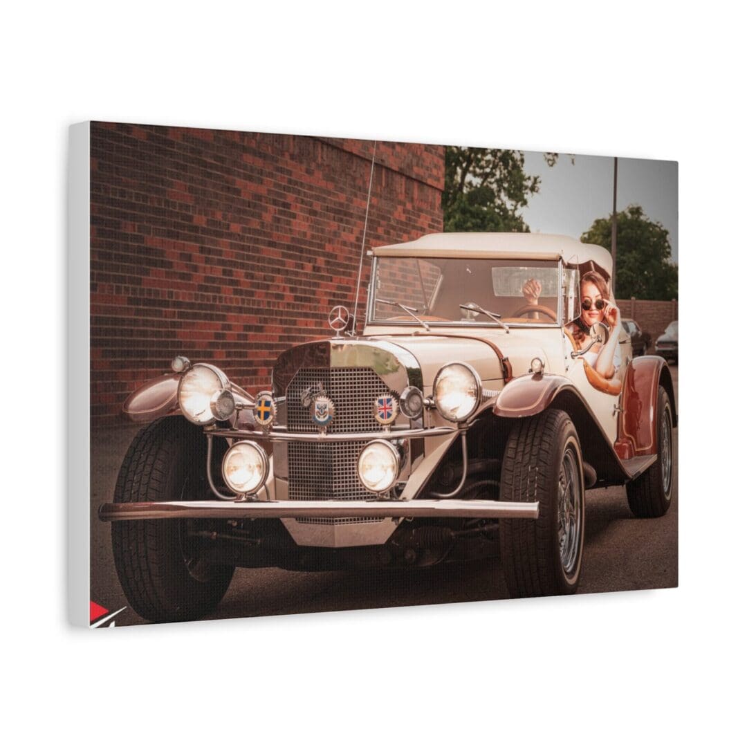 Vintage car parked near a brick wall with greenery in the background.